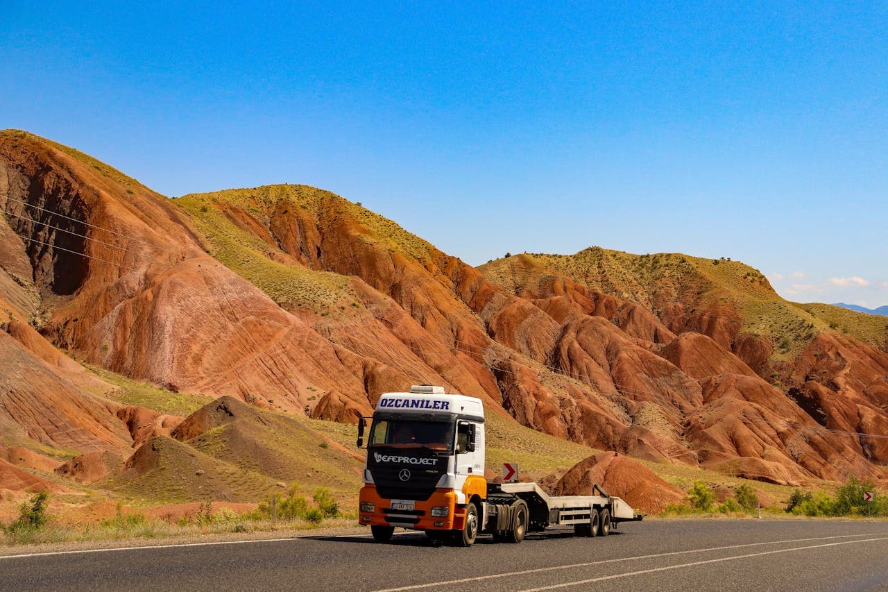 Truck carrier on mountain road